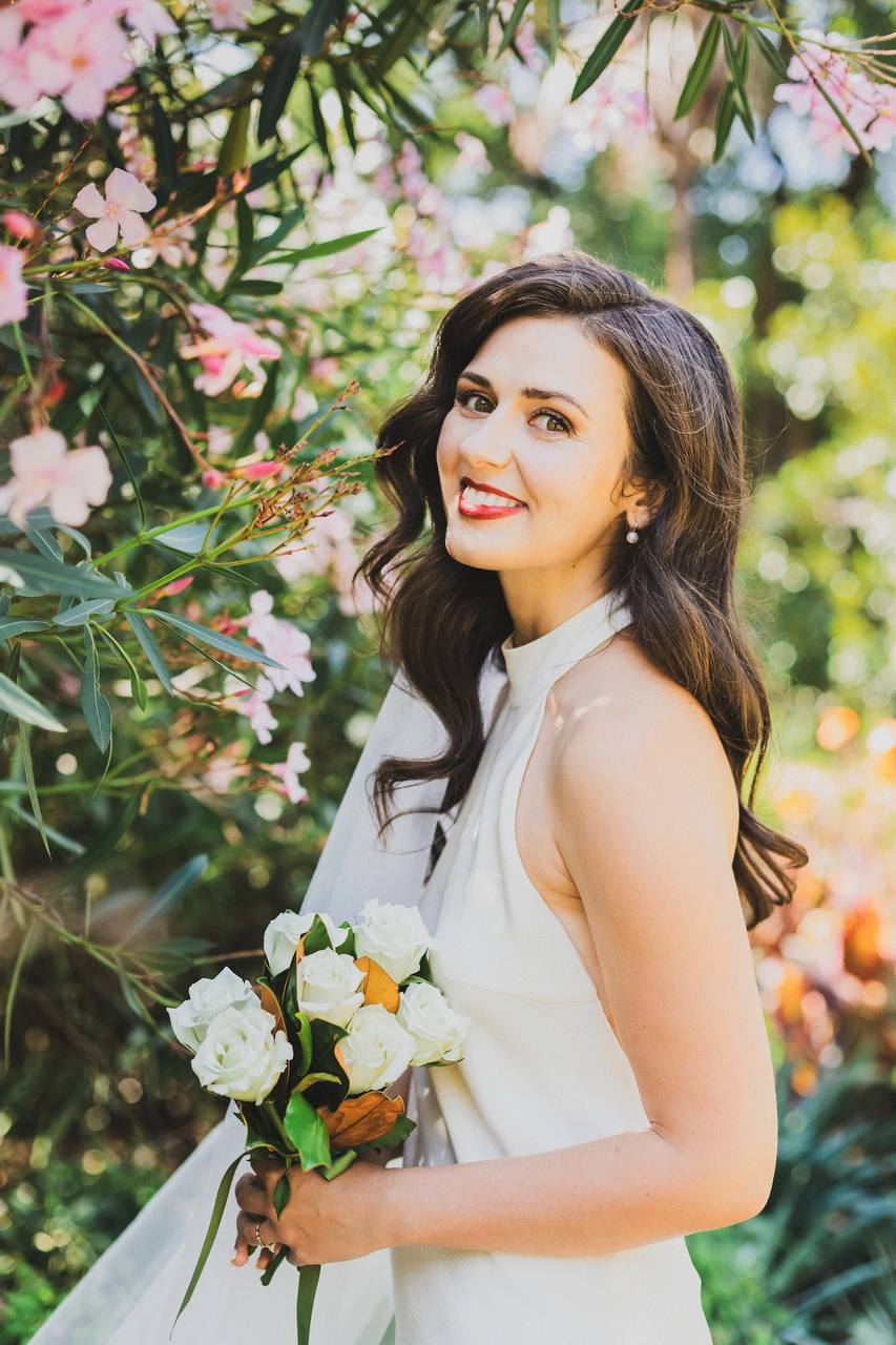 Bridal hair and makeup look with white bouquet