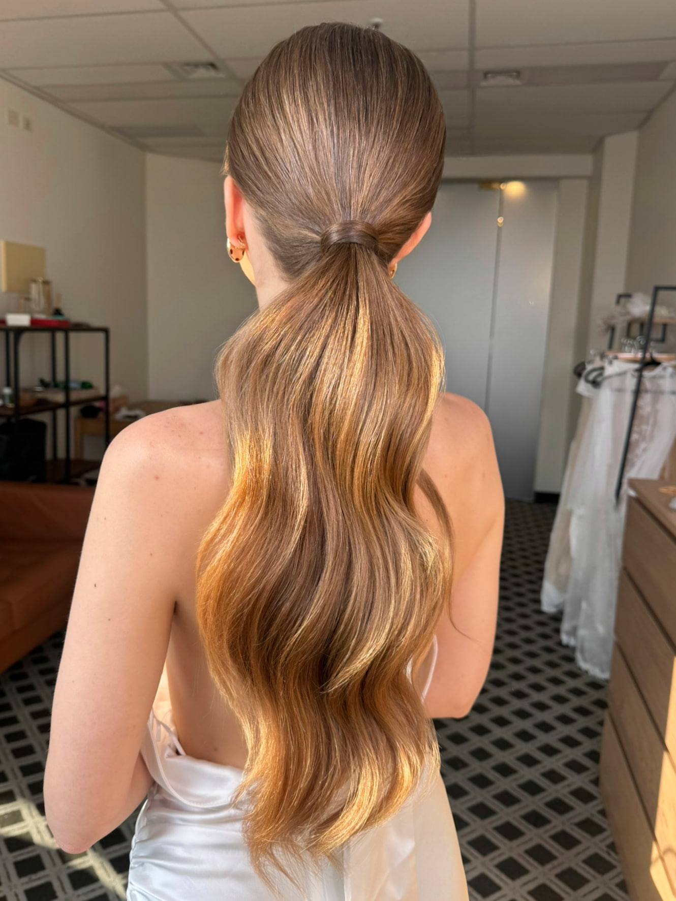 Sleek low ponytail bridal hair with soft waves — Marikate Makeup Melbourne
