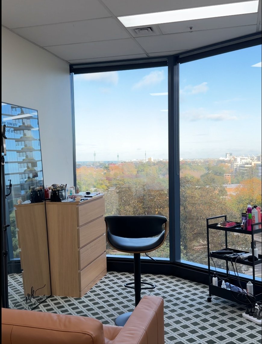Marikate Makeup private Melbourne studio — corner windows with skyline view, vanity and styling chair